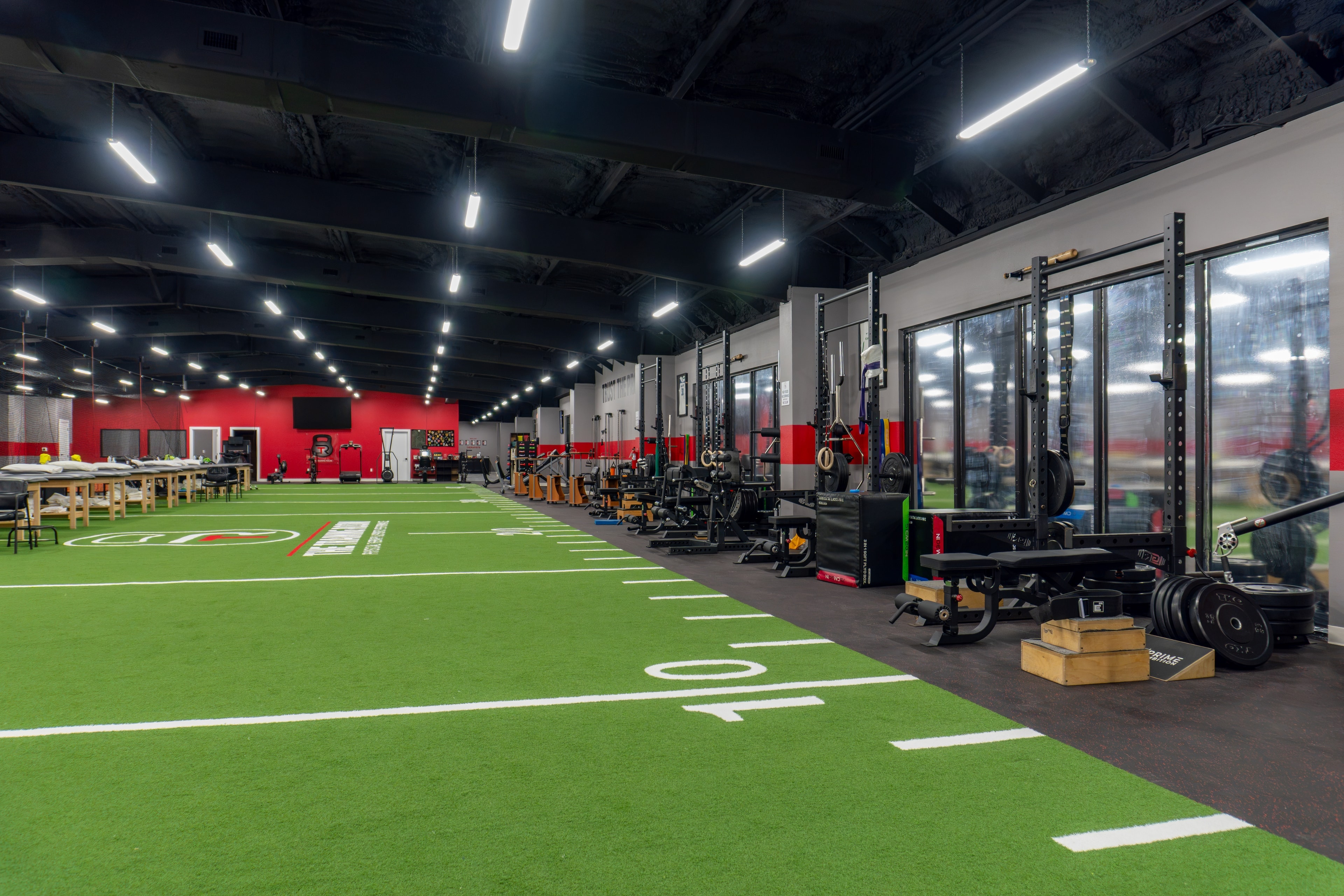 The Training Room Corpus Christi turf floor with power racks and strength equipment