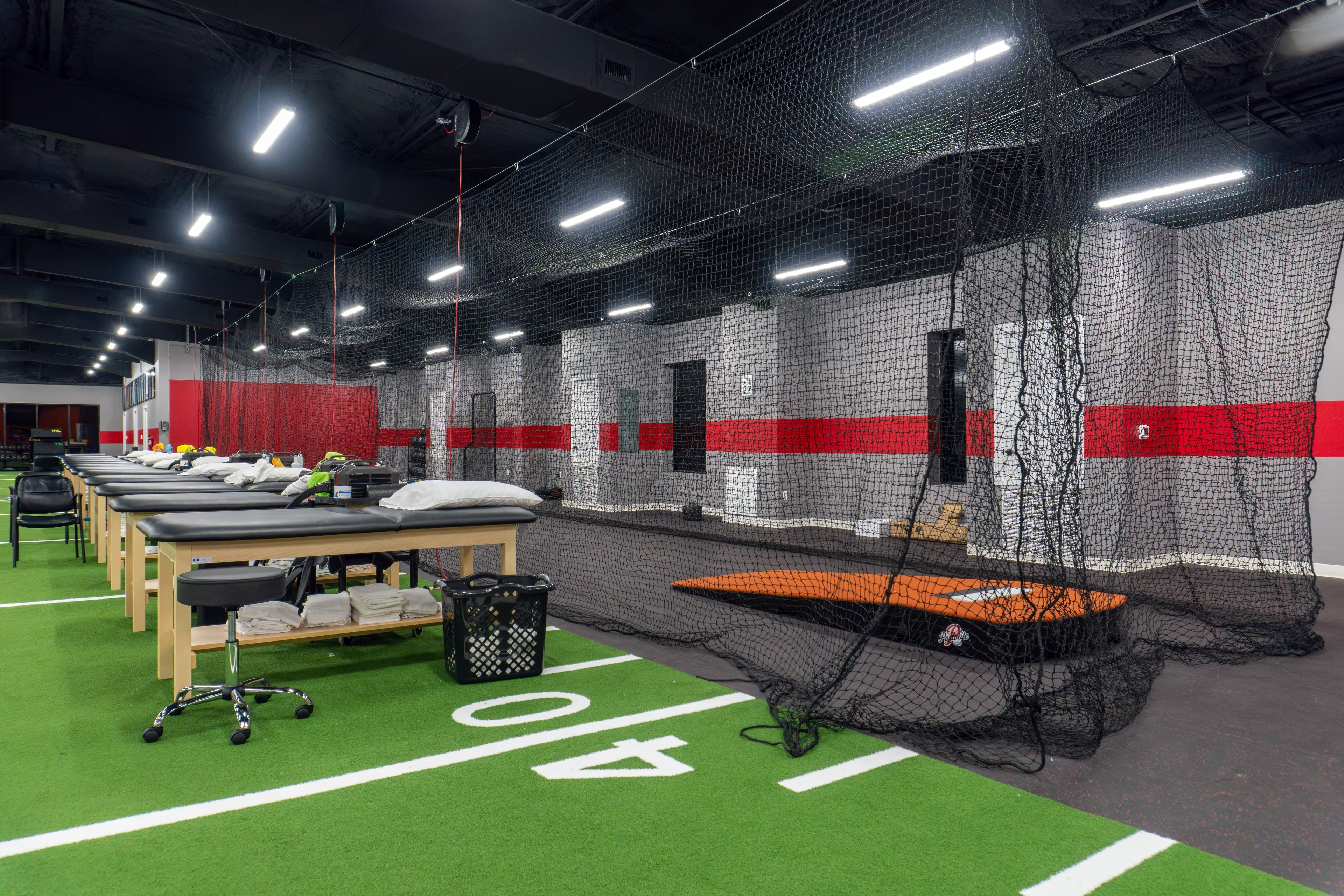 The Training Room Corpus Christi PT tables and batting cage nets