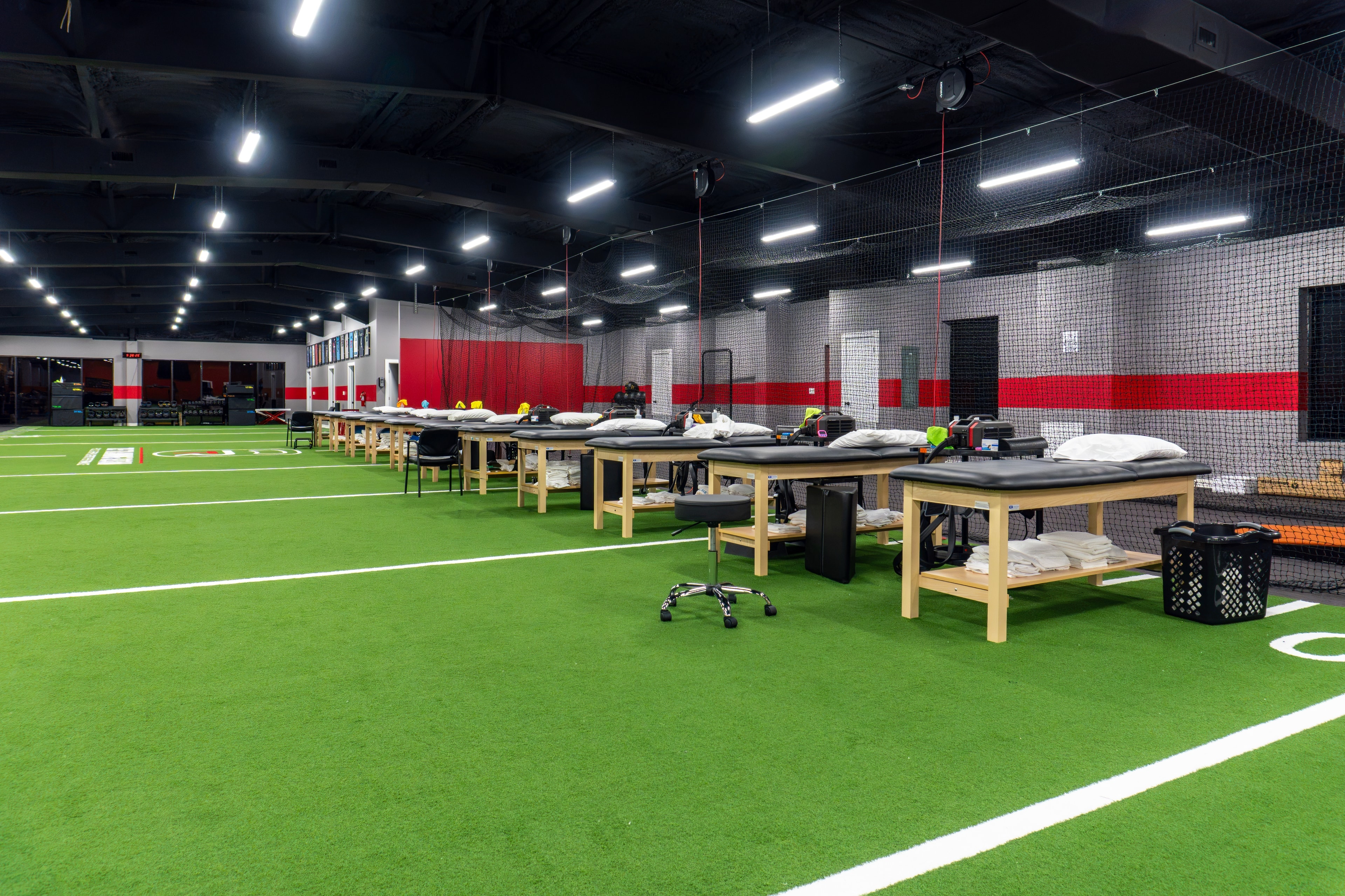 The Training Room Corpus Christi PT treatment tables along turf