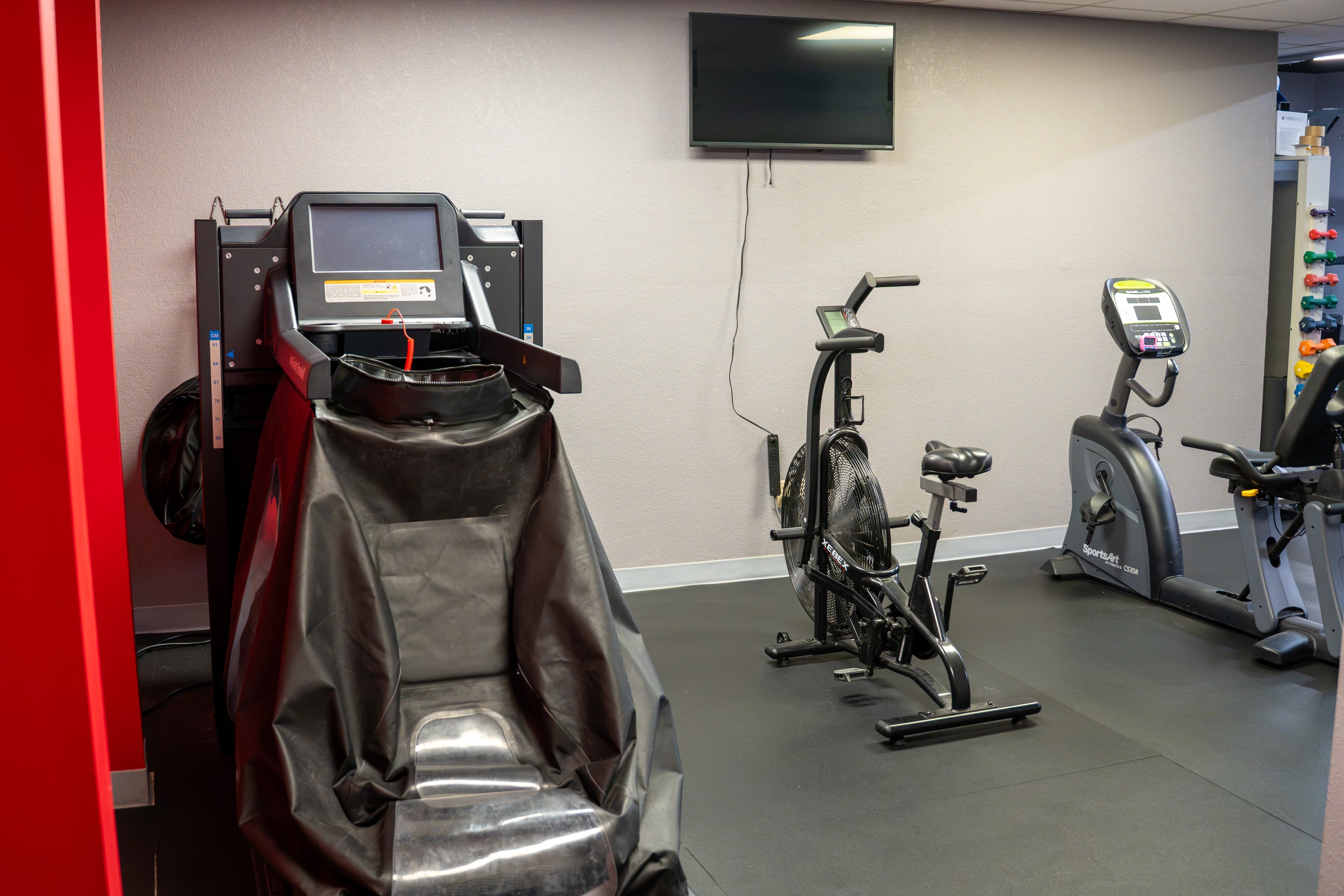 The Training Room Portland cardio room with Alter-G, air bike and stationary bikes